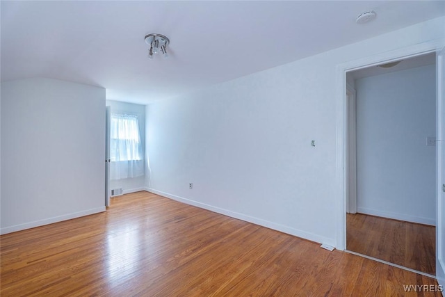165 Kelvin Dr, Tonawanda, NY 14223 - spare room with a smoke detector and wood finished floors
