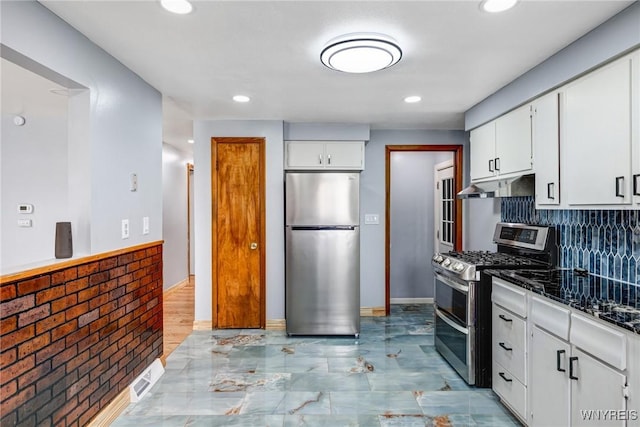 41 Dennis Ln, Cheektowaga, NY 14227 - kitchen with appliances with stainless steel finishes, under cabinet range hood, white cabinetry, recessed lighting, and tasteful backsplash