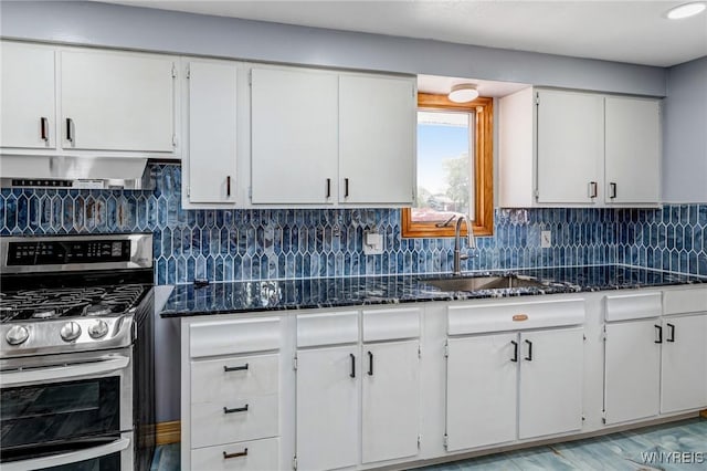 41 Dennis Ln, Cheektowaga, NY 14227 - kitchen with range with two ovens, white cabinetry, and dark stone counters