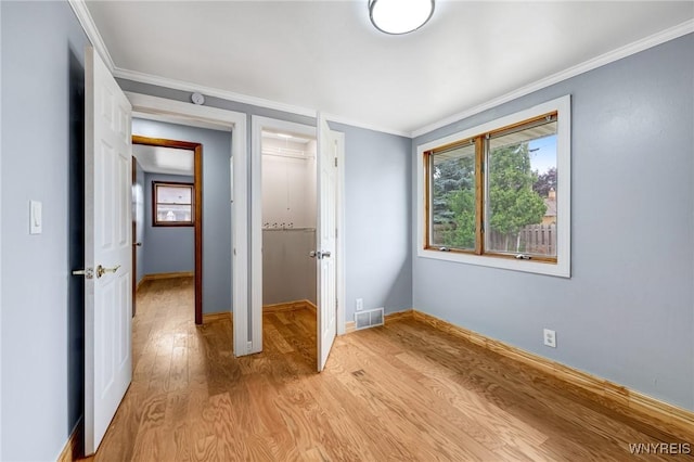 41 Dennis Ln, Cheektowaga, NY 14227 - unfurnished bedroom featuring light wood-type flooring and ornamental molding