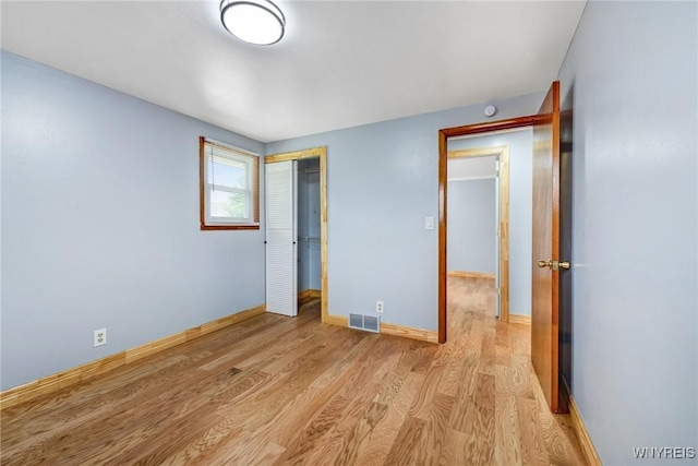 41 Dennis Ln, Cheektowaga, NY 14227 - unfurnished bedroom featuring light wood finished floors and a closet