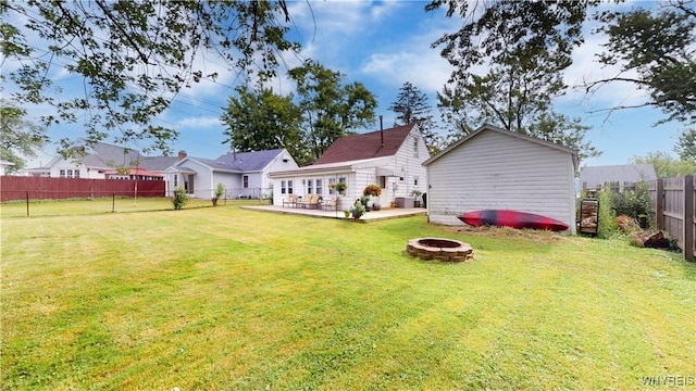 78 Heather Rd, Cheektowaga, NY 14225 - rear view of property with a fire pit, a fenced backyard, and an outbuilding