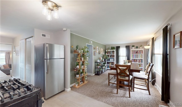 78 Heather Rd, Cheektowaga, NY 14225 - dining area with healthy amount of natural light and light colored carpet