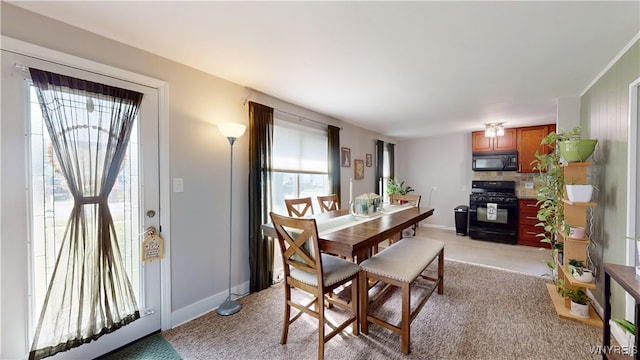 78 Heather Rd, Cheektowaga, NY 14225 - dining space featuring light colored carpet and baseboards