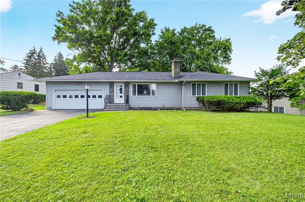 300 Sycamore, Dewitt, NY 13214 - ranch-style house with a garage, driveway, a chimney, and a front yard