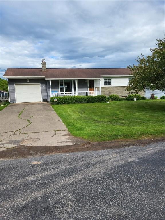 138 Dingman Hill Rd, Bainbridge, NY 13733 - ranch-style house featuring covered porch, a front lawn, an attached garage, driveway, and a chimney
