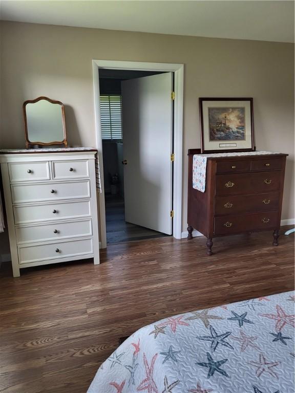 138 Dingman Hill Rd, Bainbridge, NY 13733 - bedroom featuring dark wood-type flooring and baseboards