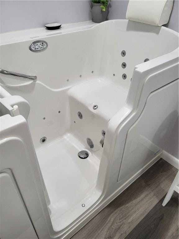 138 Dingman Hill Rd, Bainbridge, NY 13733 - bathroom featuring wood finished floors and a whirlpool tub