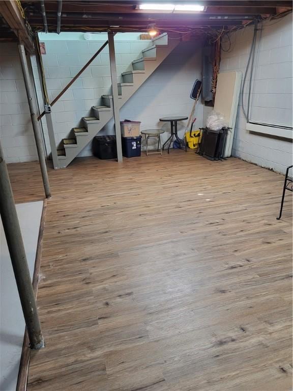 138 Dingman Hill Rd, Bainbridge, NY 13733 - unfinished basement with stairway, wood finished floors, concrete block wall, and electric panel