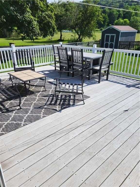 138 Dingman Hill Rd, Bainbridge, NY 13733 - deck featuring outdoor dining space and a storage shed
