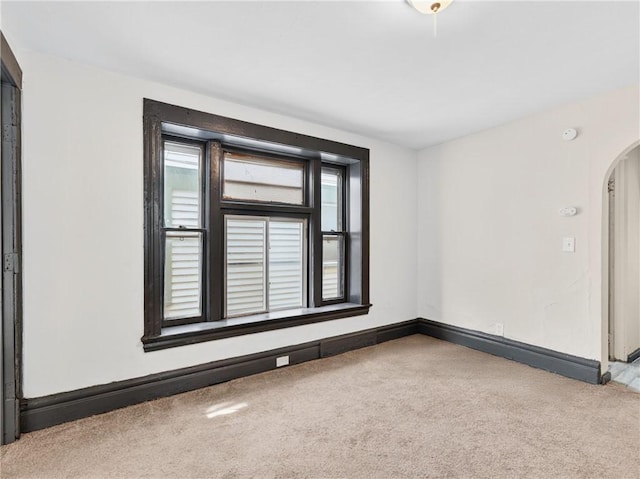 896-898 S Plymouth Ave, Rochester, NY 14608 - spare room with carpet floors, arched walkways, and a smoke detector