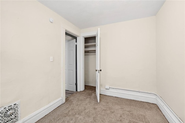 896-898 S Plymouth Ave, Rochester, NY 14608 - unfurnished bedroom featuring light carpet and a closet