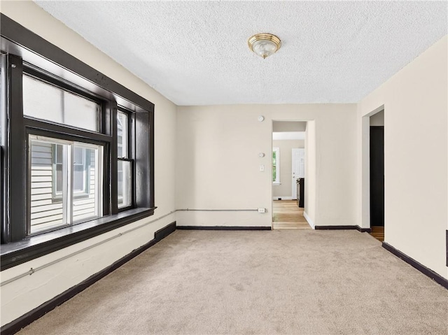 896-898 S Plymouth Ave, Rochester, NY 14608 - empty room featuring carpet and a textured ceiling