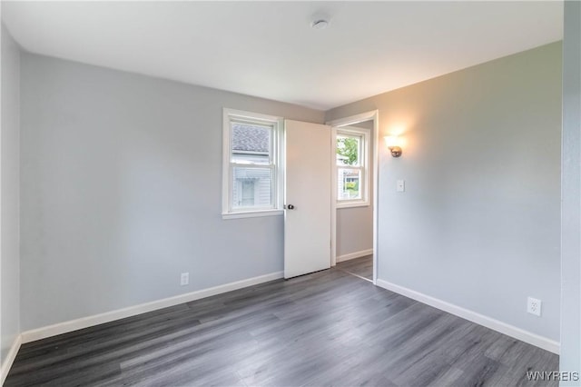 370 W W Girard Blvd, Tonawanda, NY 14217 - unfurnished room with dark wood-style flooring and a smoke detector
