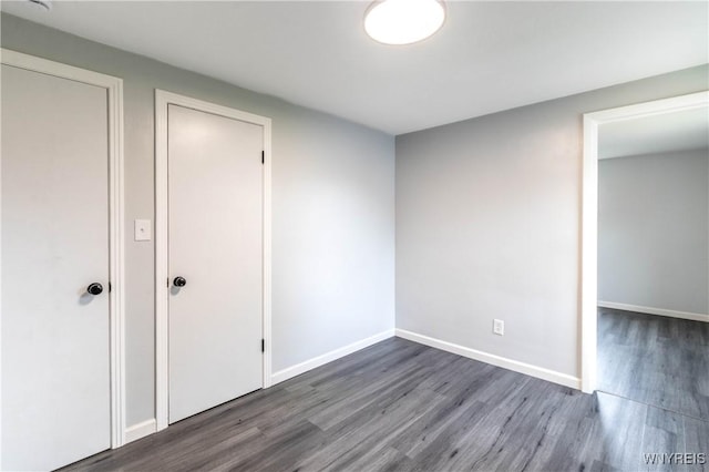 370 W W Girard Blvd, Tonawanda, NY 14217 - unfurnished bedroom with wood finished floors and baseboards