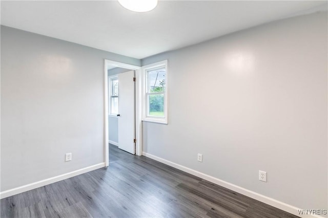 370 W W Girard Blvd, Tonawanda, NY 14217 - empty room with baseboards and dark wood-style flooring