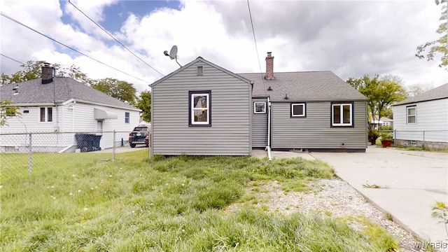 370 W W Girard Blvd, Tonawanda, NY 14217 - rear view of property with a chimney