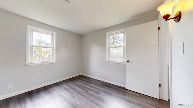 370 W W Girard Blvd, Tonawanda, NY 14217 - spare room with wood finished floors and a smoke detector