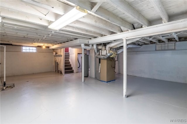 370 W W Girard Blvd, Tonawanda, NY 14217 - basement featuring stairs, heating unit, and water heater