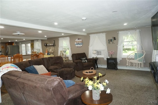 7545 River Rd, Lysander, NY 13027 - living room featuring a wood stove, recessed lighting, baseboard heating, carpet flooring, and beamed ceiling
