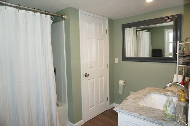 7545 River Rd, Lysander, NY 13027 - full bathroom featuring vanity, wood finished floors, and shower / bathtub combination with curtain
