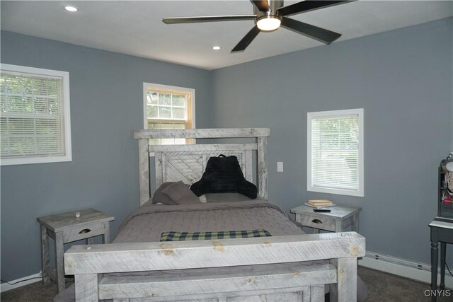7545 River Rd, Lysander, NY 13027 - bedroom with dark colored carpet, a baseboard radiator, recessed lighting, and a ceiling fan