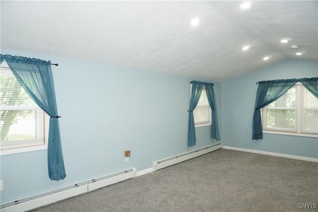7545 River Rd, Lysander, NY 13027 - empty room featuring baseboard heating, plenty of natural light, vaulted ceiling, recessed lighting, and carpet flooring