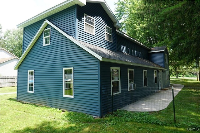 7545 River Rd, Lysander, NY 13027 - view of side of home with a lawn, roof with shingles, and cooling unit