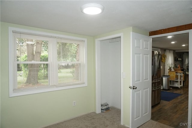 7545 River Rd, Lysander, NY 13027 - unfurnished bedroom featuring a closet and dark carpet