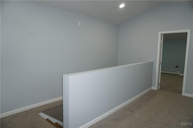 7545 River Rd, Lysander, NY 13027 - corridor with a baseboard heating unit, vaulted ceiling, carpet, recessed lighting, and an upstairs landing
