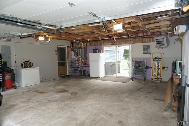 7545 River Rd, Lysander, NY 13027 - garage with freestanding refrigerator, a garage door opener, and a heating unit
