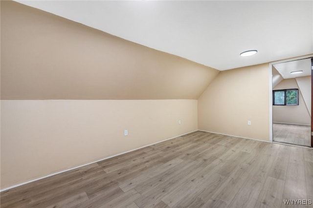 146 Longnecker St, Buffalo, NY 14206 - additional living space featuring light wood-style floors and vaulted ceiling
