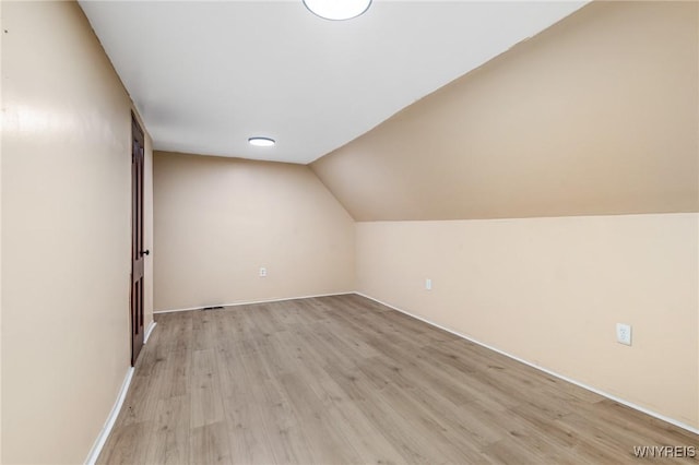 146 Longnecker St, Buffalo, NY 14206 - additional living space featuring light wood-style floors and vaulted ceiling