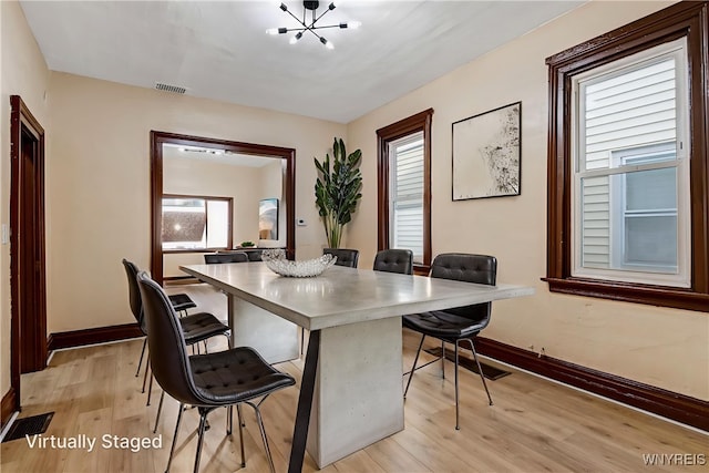 146 Longnecker St, Buffalo, NY 14206 - dining space with light wood-type flooring and a chandelier