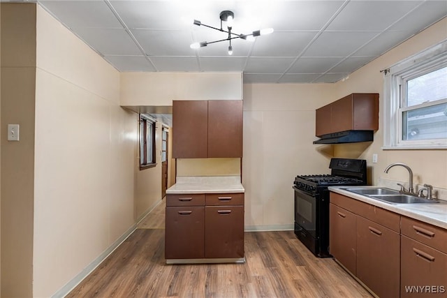 146 Longnecker St, Buffalo, NY 14206 - kitchen with black gas stove, light wood-style floors, and light countertops