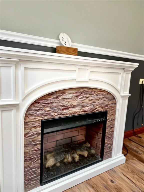 110 Mcmaster St, Bath, NY 14810 - detailed view of a fireplace and wood finished floors