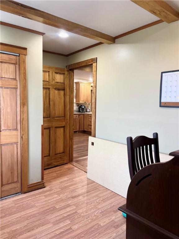 110 Mcmaster St, Bath, NY 14810 - dining space with light wood-type flooring, beamed ceiling, and crown molding