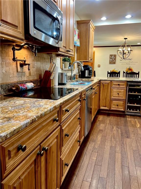 110 Mcmaster St, Bath, NY 14810 - kitchen with appliances with stainless steel finishes, wine cooler, dark wood finished floors, light stone countertops, and recessed lighting