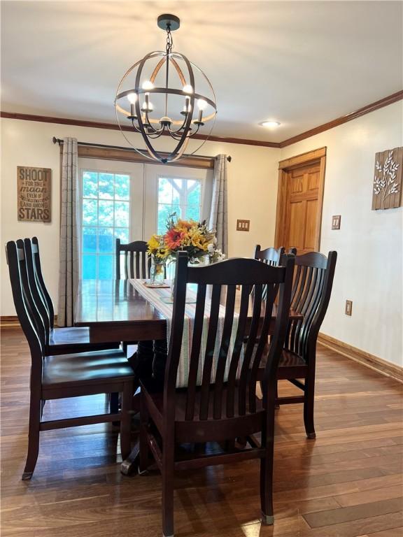 110 Mcmaster St, Bath, NY 14810 - dining area featuring a chandelier, wood finished floors, and ornamental molding