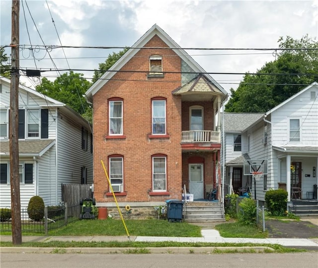 364 W 3rd St, Elmira City, NY 14901 - view of front of property with brick siding and a balcony