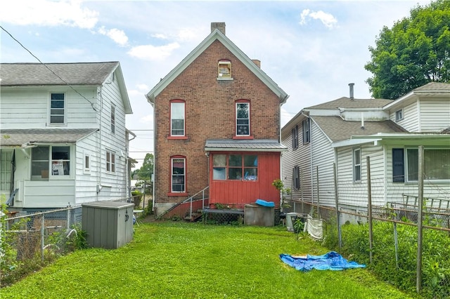 364 W 3rd St, Elmira City, NY 14901 - back of property with brick siding, a chimney, and a fenced backyard