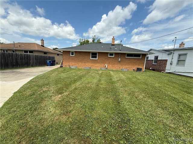 31 Noel Dr, Amherst, NY 14221 - back of property with brick siding and a chimney