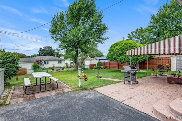 7 Cannas Ct, Cheektowaga, NY 14227 - fenced backyard with an outdoor fire pit, area for grilling, and a patio area