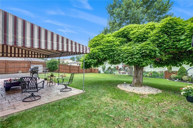 7 Cannas Ct, Cheektowaga, NY 14227 - fenced backyard with a patio