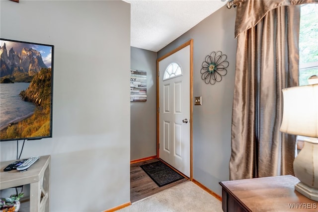 7 Cannas Ct, Cheektowaga, NY 14227 - foyer entrance with baseboards and a textured ceiling