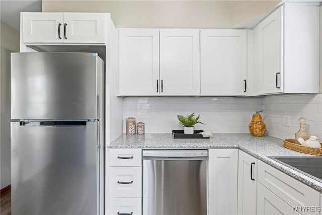 374 Dewey Ave, Buffalo, NY 14214 - kitchen with stainless steel appliances, white cabinetry, tasteful backsplash, and light stone countertops