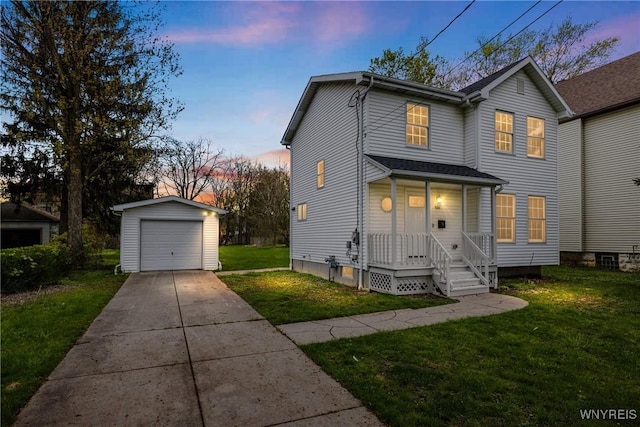 374 Dewey Ave, Buffalo, NY 14214 - traditional home featuring an outbuilding, a detached garage, covered porch, concrete driveway, and a lawn