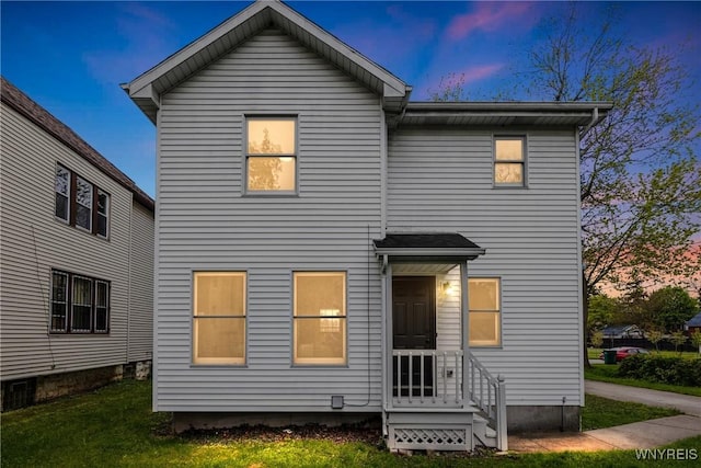 374 Dewey Ave, Buffalo, NY 14214 - rear view of house with a lawn and entry steps