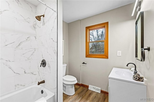 374 Dewey Ave, Buffalo, NY 14214 - full bath featuring vanity, washtub / shower combination, and wood finished floors