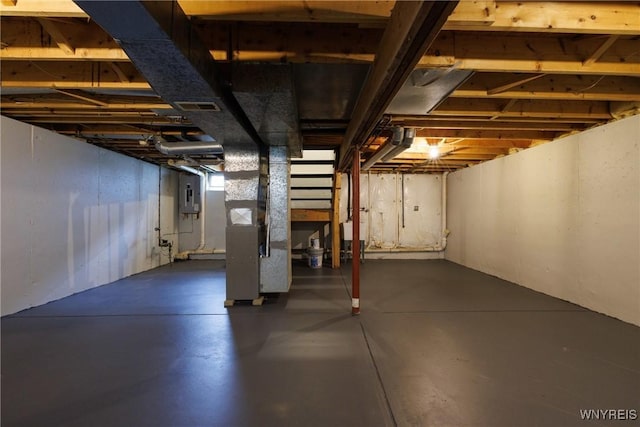 374 Dewey Ave, Buffalo, NY 14214 - unfinished basement with electric panel and heating unit